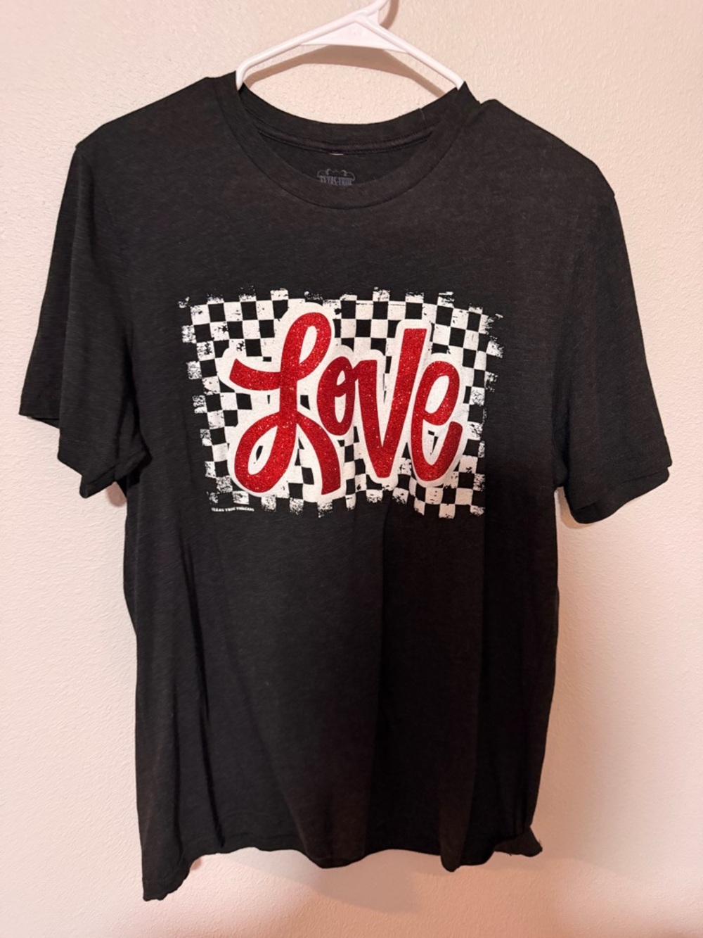 Black Tee with Red 'Love' Script and Checkerboard Graphic